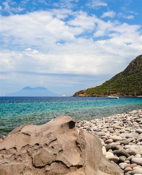 Filicudi island pebble beach, Italy. — Stock Photo © EStruk #88600346