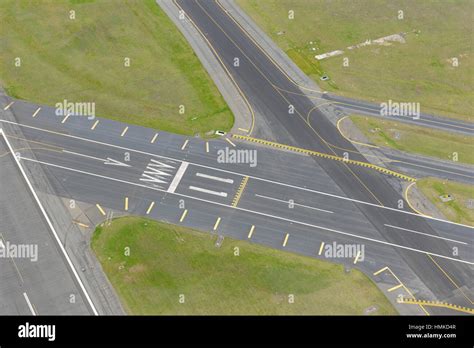 runway 11 threshold and taxiway markings Stock Photo - Alamy