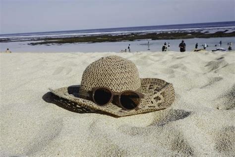 Beach Hat Stock Photos, Images and Backgrounds for Free Download