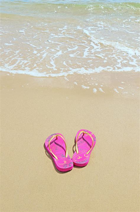 Flip Flops On A Sandy Beach by Kathy Collins