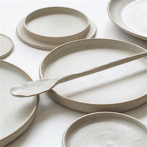 Minimal, clean white ceramic plates with clean lines, modern shaping ...