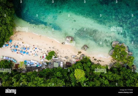 Tourists relax at the Padang Padang Beach featured in the movie "Eat ...