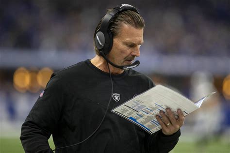 Raiders offensive coordinator Greg Olson looks at his plays during the ...