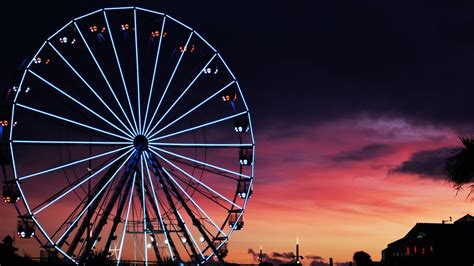 Ferris wheel 4K Wallpaper, Silhouette, Sunset, Neon Lights, Amusement park, Purple sky ...