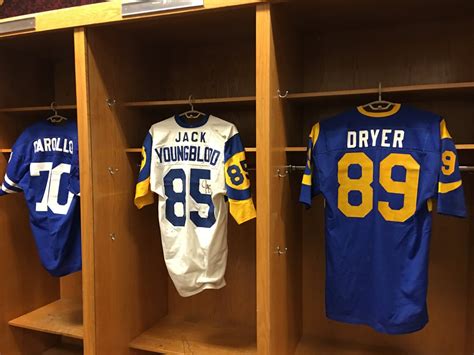 Old la rams jerseys are hanging up inside the home locker room at the ...