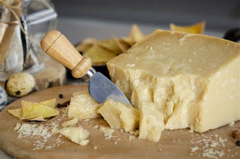 Parmigiano-Reggiano with Cheese Knife Stock Photo - Image of appetizer, cuisine: 141210374