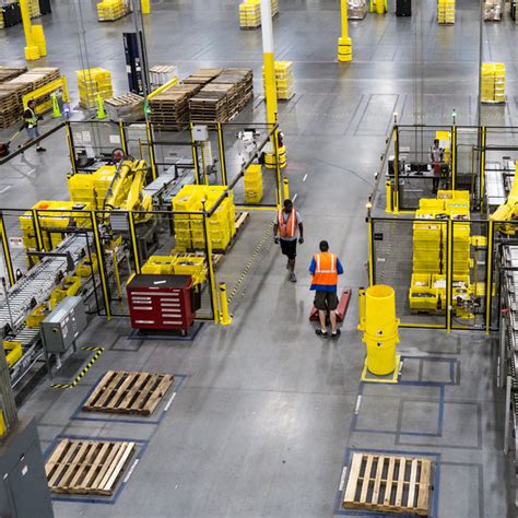 As Amazon Pushes Forward With Robots, Workers Find New Roles - The New York Times