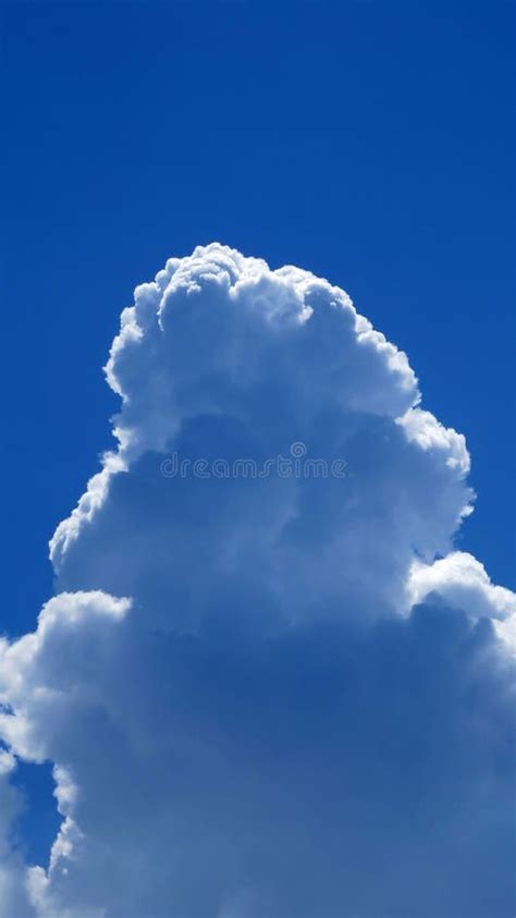 Tall Cumulonimbus Cloud Against Blue Sky Stock Photo - Image of billowing, beautiful: 147569242