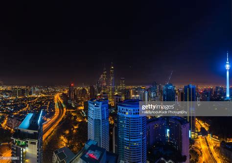 Malaysia, Kuala Lumpur, elevated view of skyline at night, showing ...