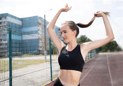 Premium Photo | Portrait of a young female athlete in motion outdoor sports activities