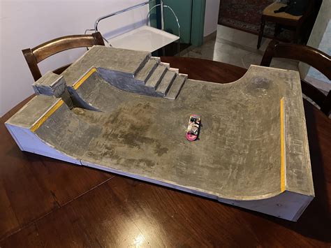 Concrete skatepark that I build. Need to put a rail on the stairs and it will be done, but I ...