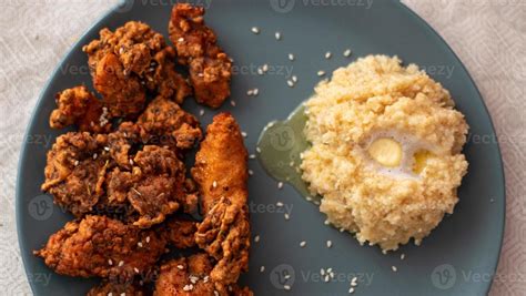 crispy chicken with garnish of porridge 16460669 Stock Photo at Vecteezy