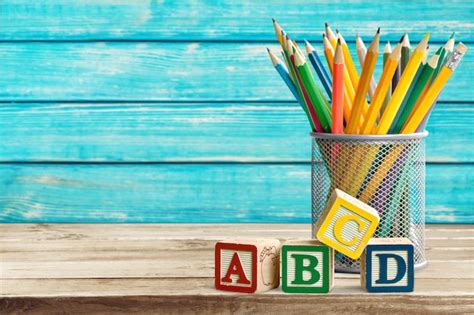 Premium Photo | Abc blocks and pencils on desk background