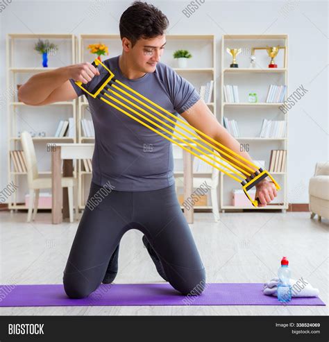 Young Man Exercising Image & Photo (Free Trial) | Bigstock