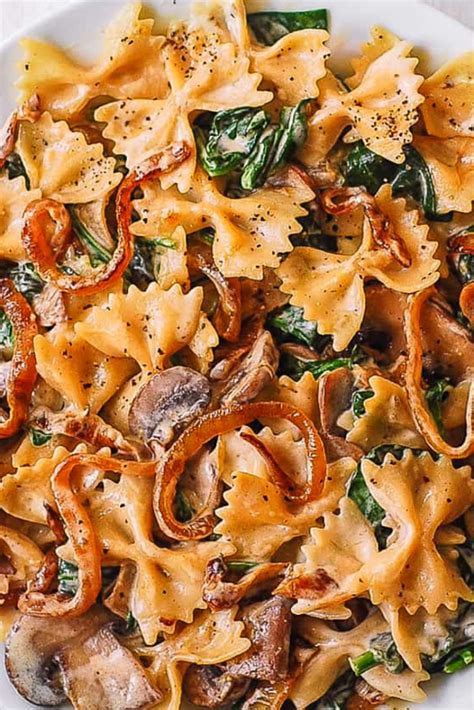 CREAMY BOW TIE PASTA WITH SPINACH MUSHROOMS, AND CARAMELIZED ONIONS ...