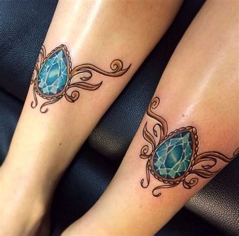 Beautiful dual jewel leg tattoo; the colours are breath-taking! Wrist Bracelet Tattoo, Gem ...