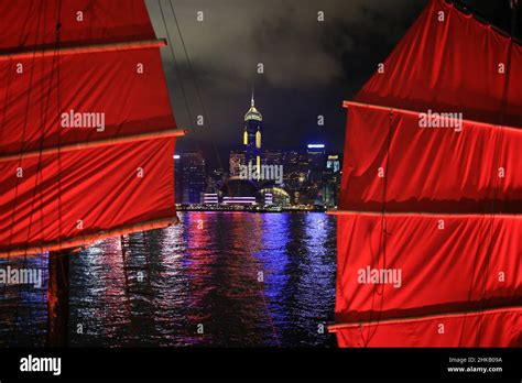 Chinese red junk with the victoria harbor night view background in hong ...