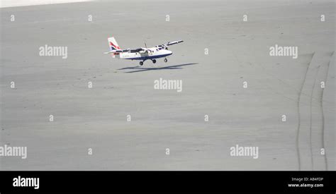 propeller plane landing on beach runway Barra airport Isle of Barra ...