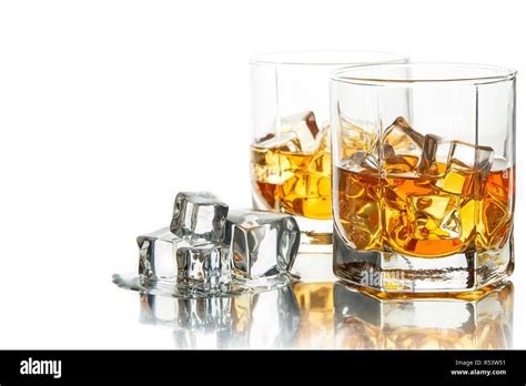 Whiskey glasses with ice Stock Photo - Alamy