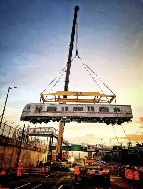 Hyundai Rotem MRT 7 being hoisted by a crane in the Philippines (Under construction) : r/trains