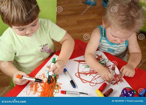 Two children drawing stock image. Image of casual, beautiful - 4034949