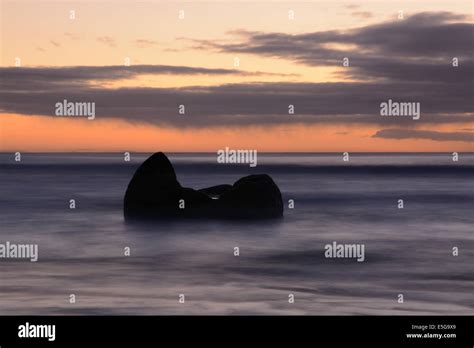 Sunrise on the Koekohe Beach with the Moeraki Boulders Stock Photo - Alamy