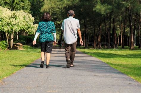 Old people walking in the park | Stock image | Colourbox