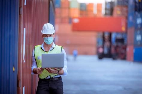 Premium Photo | Portrait team dock workers posing under working and checking production process ...