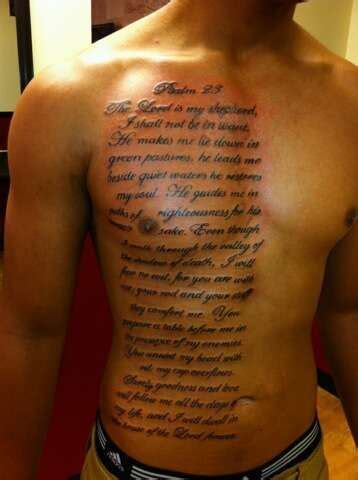 a man with a tattoo on his chest that says, the lord is in heaven