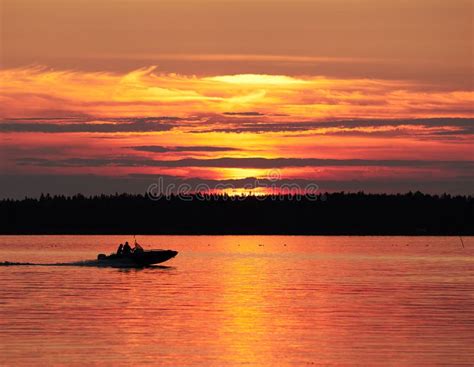 A Fishing Boat on a Lake in Sunset Scene Stock Image - Image of dramatic, outdoor: 136647931