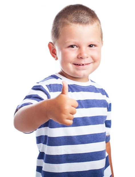 Little boy smiling with a thumbs up Photo | Free Download