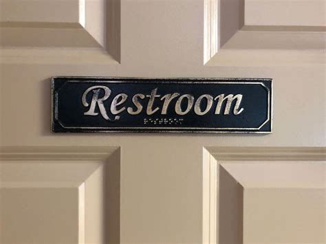 Brass Antiqued Restroom Door Sign with Braille 9 5/8" X 2 3/8" - Custom Metal Signs - KCastings, Inc