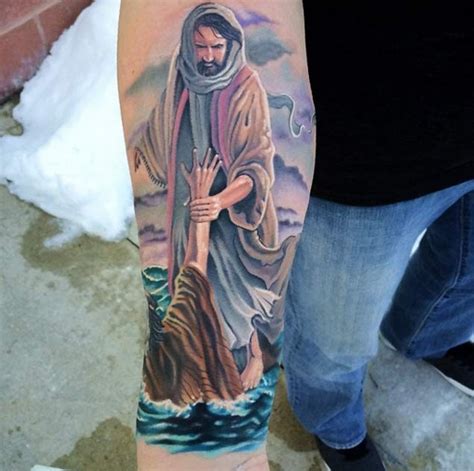 Tatuaje en el antebrazo, santo con hombre, tema religioso - Tattooimages.biz