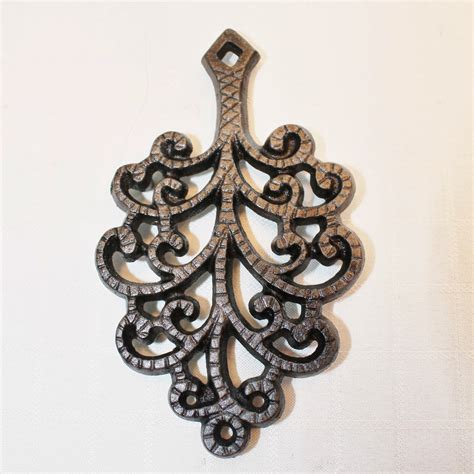 Tuesday's Take on an Antique Treasure: Cast Iron Trivets - Adirondack Girl @ Heart