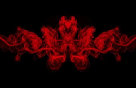 Premium Photo | Art of red smoke abstract on black background, darkness concept