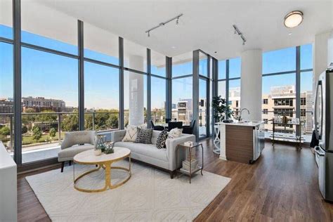 River North Chicago modern apartment with floor to ceiling windows showcasing city views ...