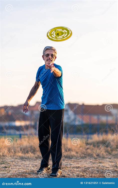 Senior Man Playing Frisbee in the Park Stock Image - Image of casual ...