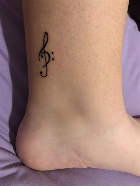 Treble & bass clef tattoo | Music tattoo designs, Tattoos, Ankle foot ...