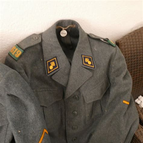 3 Swiss Military Uniforms, jackets and trousers with emblems - Catawiki