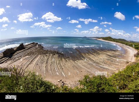 Beautiful day at the beach in Popoyo, Nicaragua, with deep color in the water and sunny weather ...