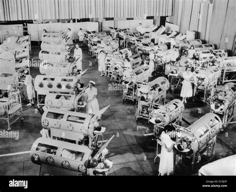 Nurse attend to a room full of polio patients in iron lung Stock Photo ...