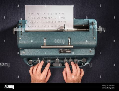 A woman typing in braille using a Perkins Brailler typewriter Stock ...