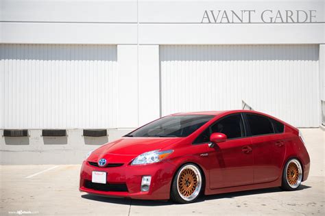 Red Toyota Prius Gets Upgraded Lighting and Bronze Avant Garde Wheels — CARiD.com Gallery