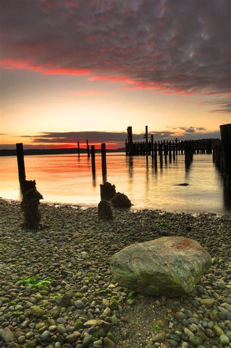 Sunset over pebble beach stock image. Image of nature - 11098891