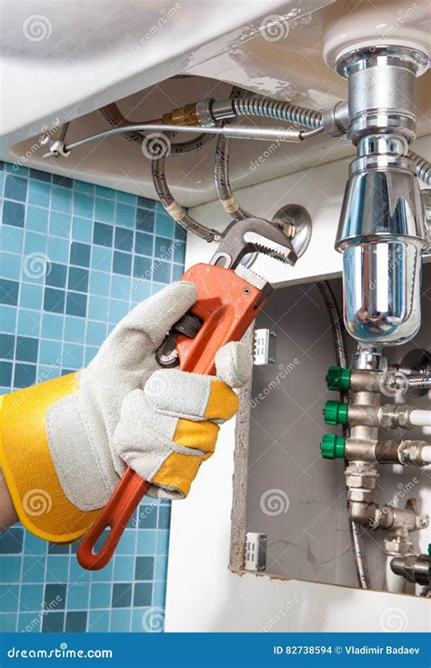 Repairing a Pipe Under Sink. Plumber Stock Photo - Image of pipes, pattern: 82738594