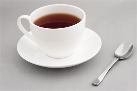 Generic white cup of hot black tea - Free Stock Image