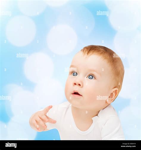 curious baby looking up Stock Photo - Alamy