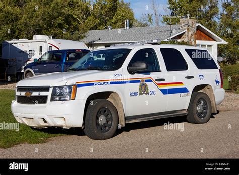 rcmp police patrol car parked outside a small town house in rural ...