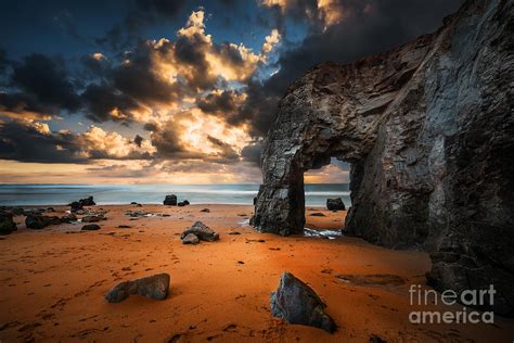 Stone arch in beach at sunset landscape photo Photograph by Thomas Jones | Fine Art America