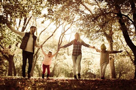 Family in Park Walking Trough Park Stock Photo - Image of kids, meadow ...